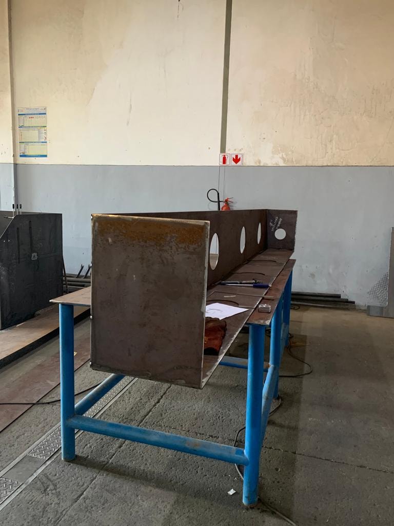 Side profile — mine workshop steel structure mid-assembly